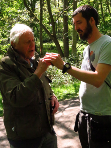 Sir David Attenborough and Keith McMahon holding a bird